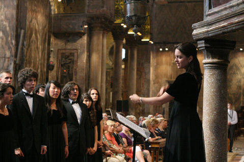 Christine Tavares directs inside St. Mark's Church in Venice, Italy.